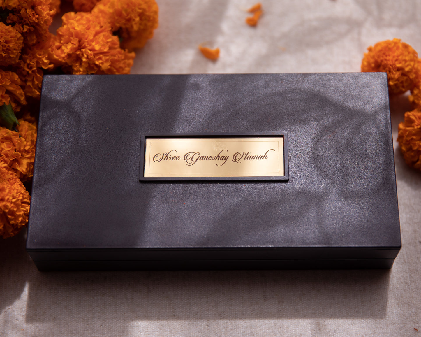 LeelaTheStore’s 24K Lord Ganesha Pooja Box - All the symbolism and imagery seen within has been wrapped in 24KT gold foil, while the box is made of wood.