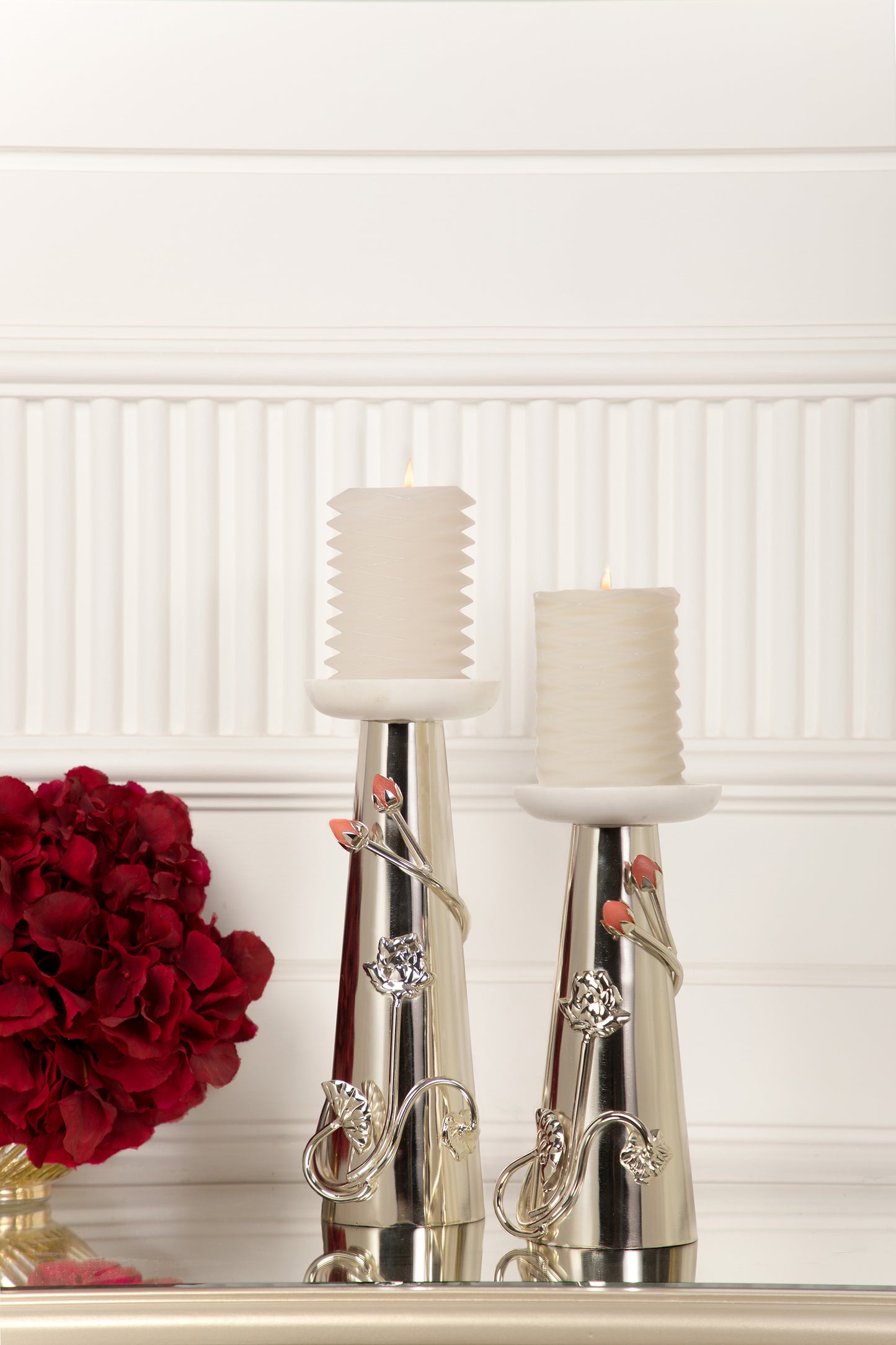 Coated with Silver, these candle stands offer a radiant and luxurious finish that adds a touch of sophistication and opulence to your home.