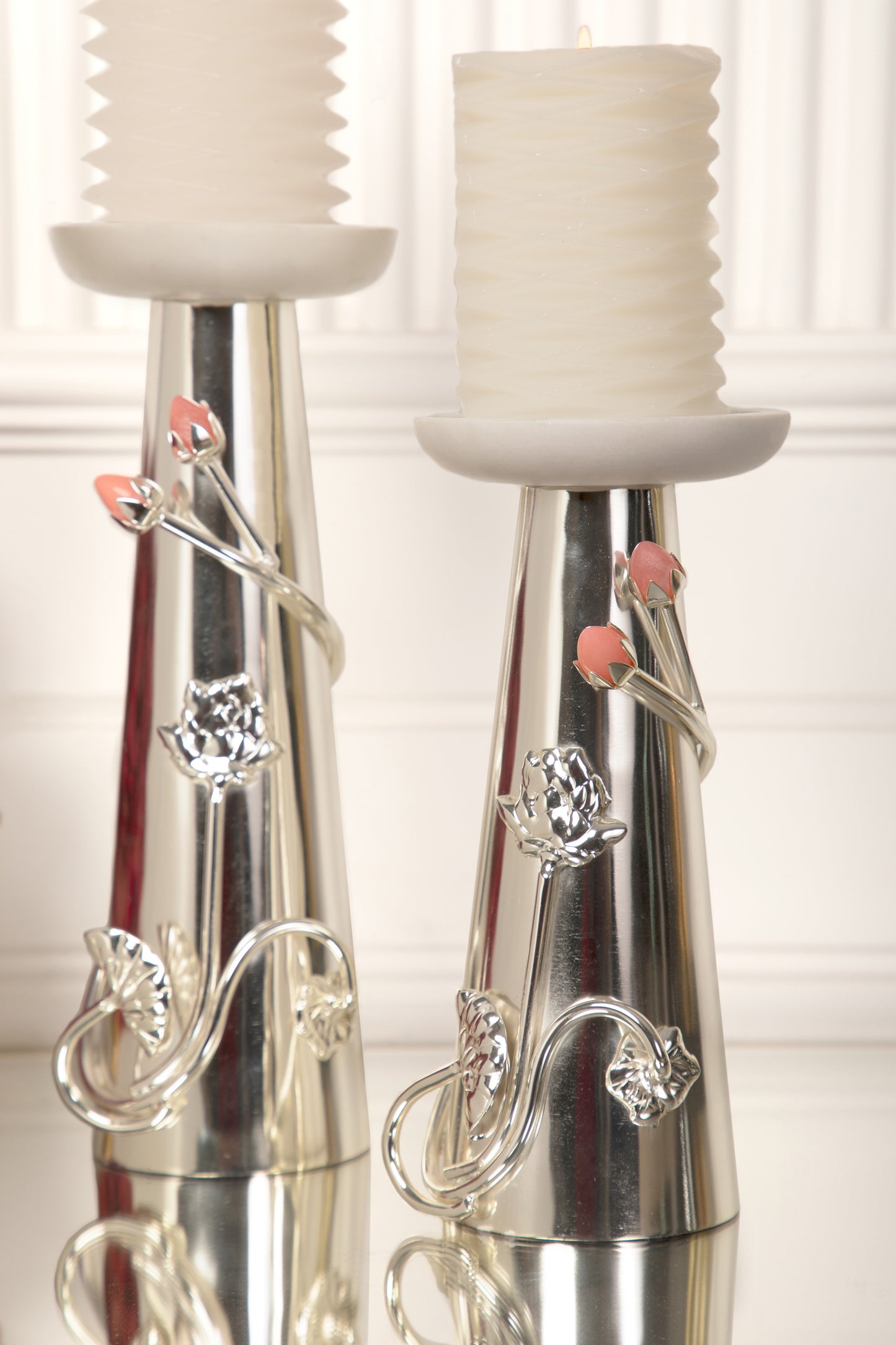 Coated with Silver, these candle stands offer a radiant and luxurious finish that adds a touch of sophistication and opulence to your home.