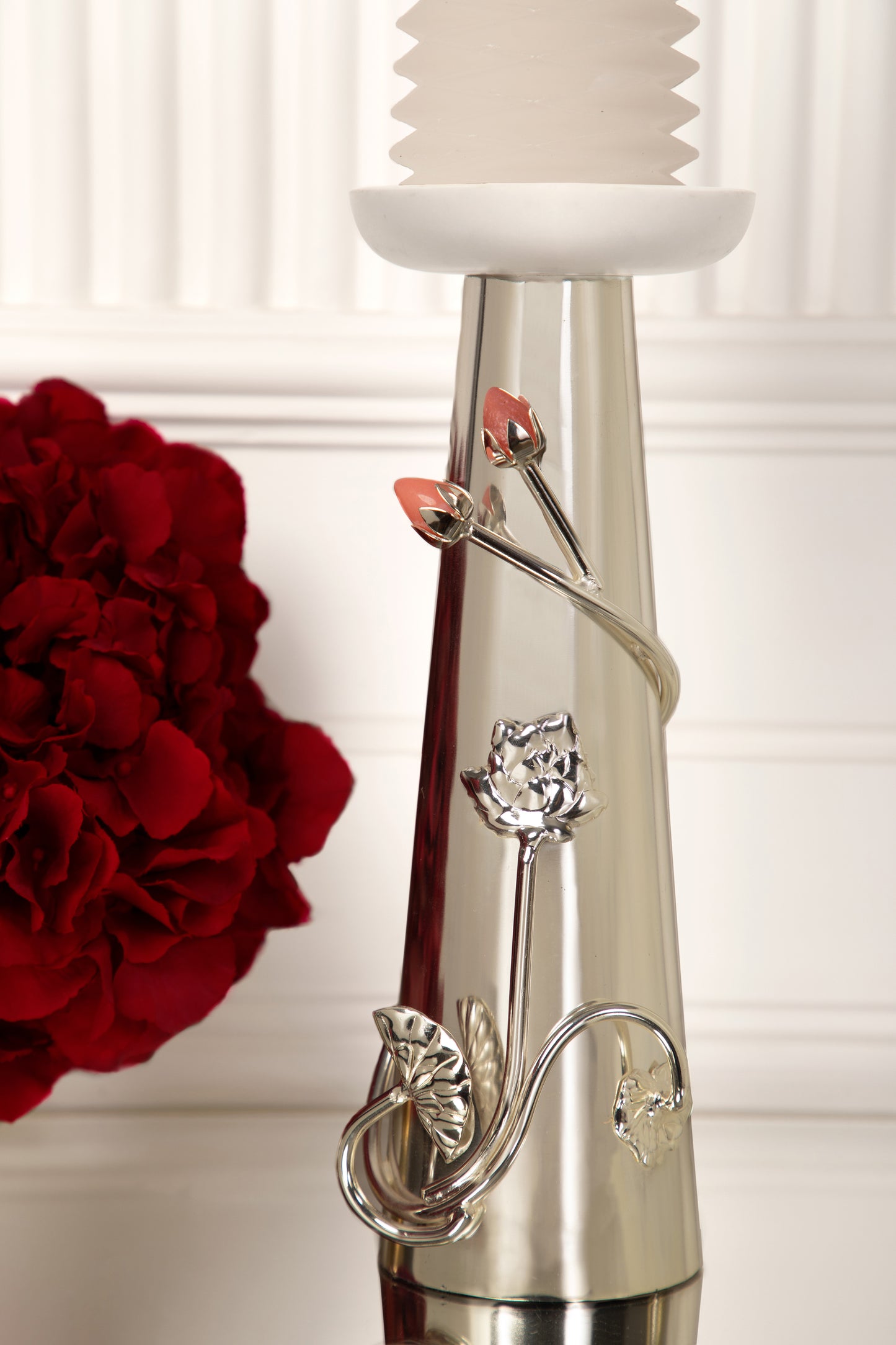 Coated with Silver, these candle stands offer a radiant and luxurious finish that adds a touch of sophistication and opulence to your home.