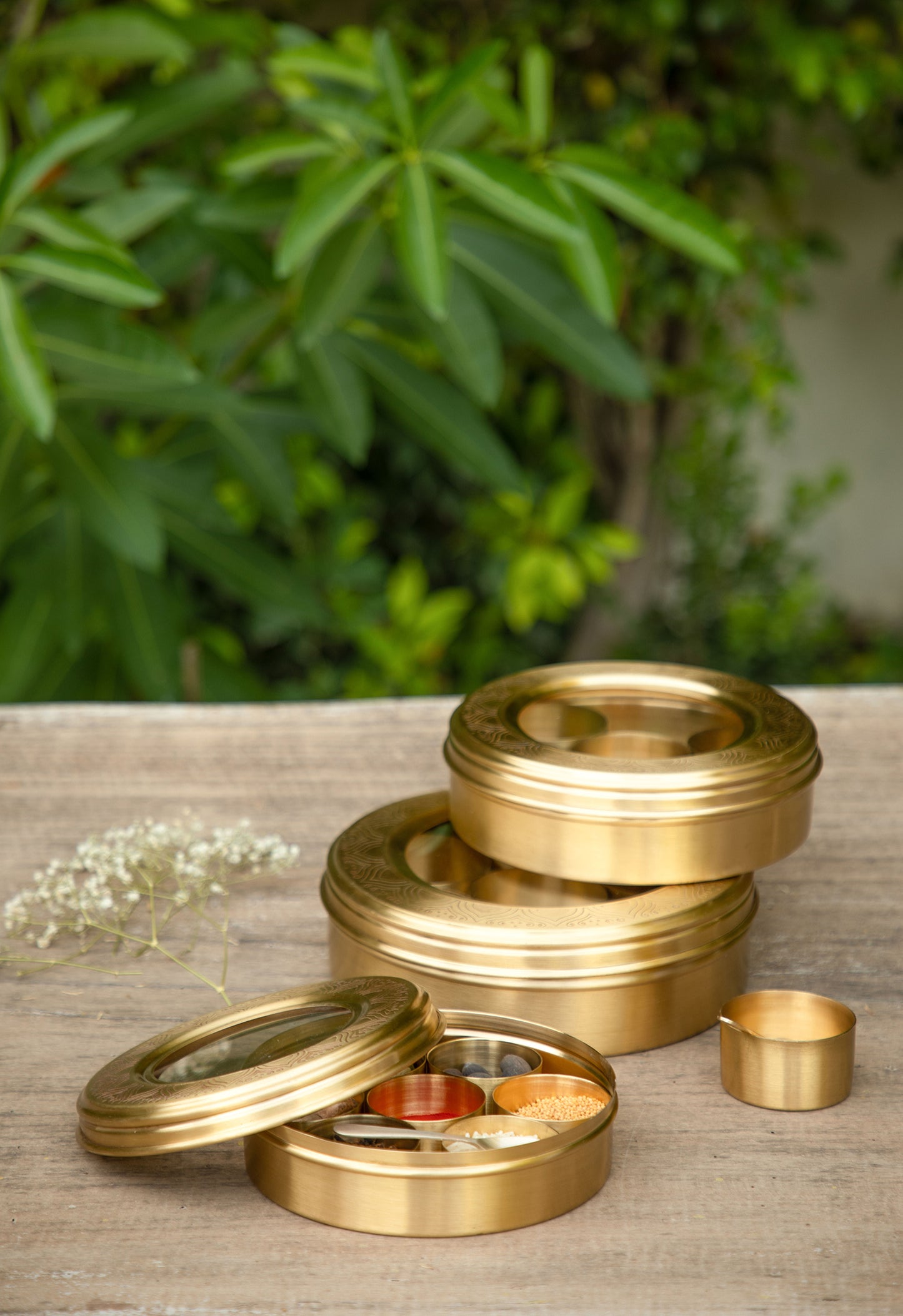 Crafted from brass, these masala box offers a lustrous finish that adds a touch of sophistication and opulence to your kitchen.