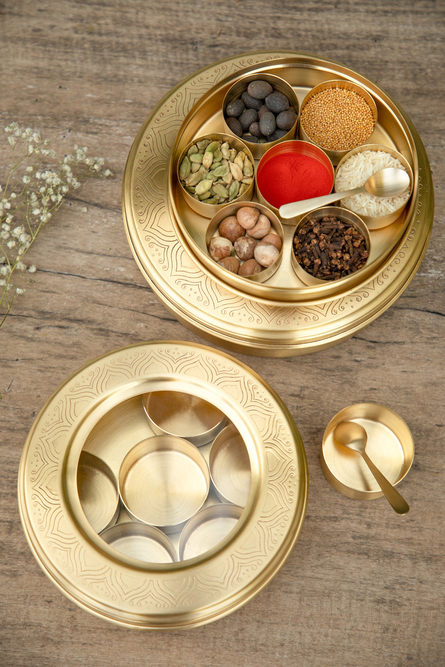 Crafted from brass, these masala box offers a lustrous finish that adds a touch of sophistication and opulence to your kitchen.