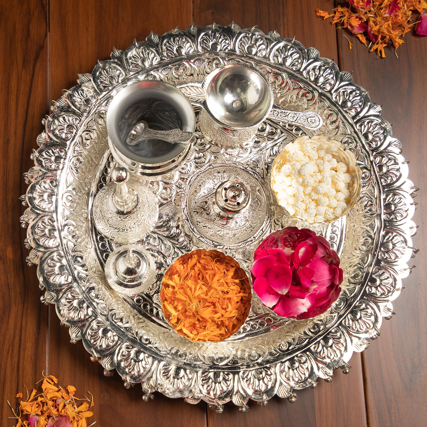 Plated from silver, this thali is a glistening masterpiece that exudes sophistication and charm.