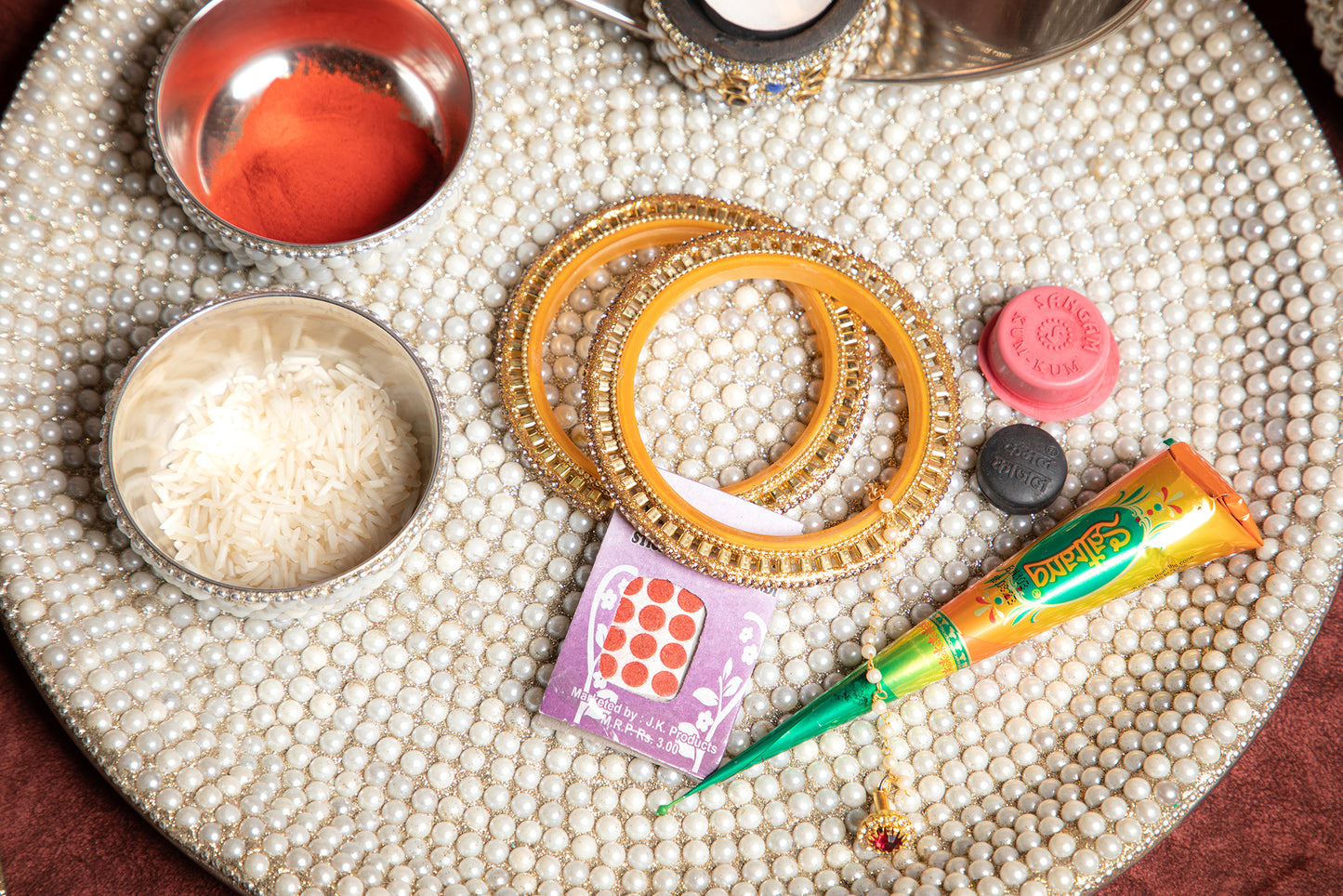 Our Karwa Chauth Pearl Thali is a stunning masterpiece, crafted to enhance the significance and beauty of this cherished ritual.