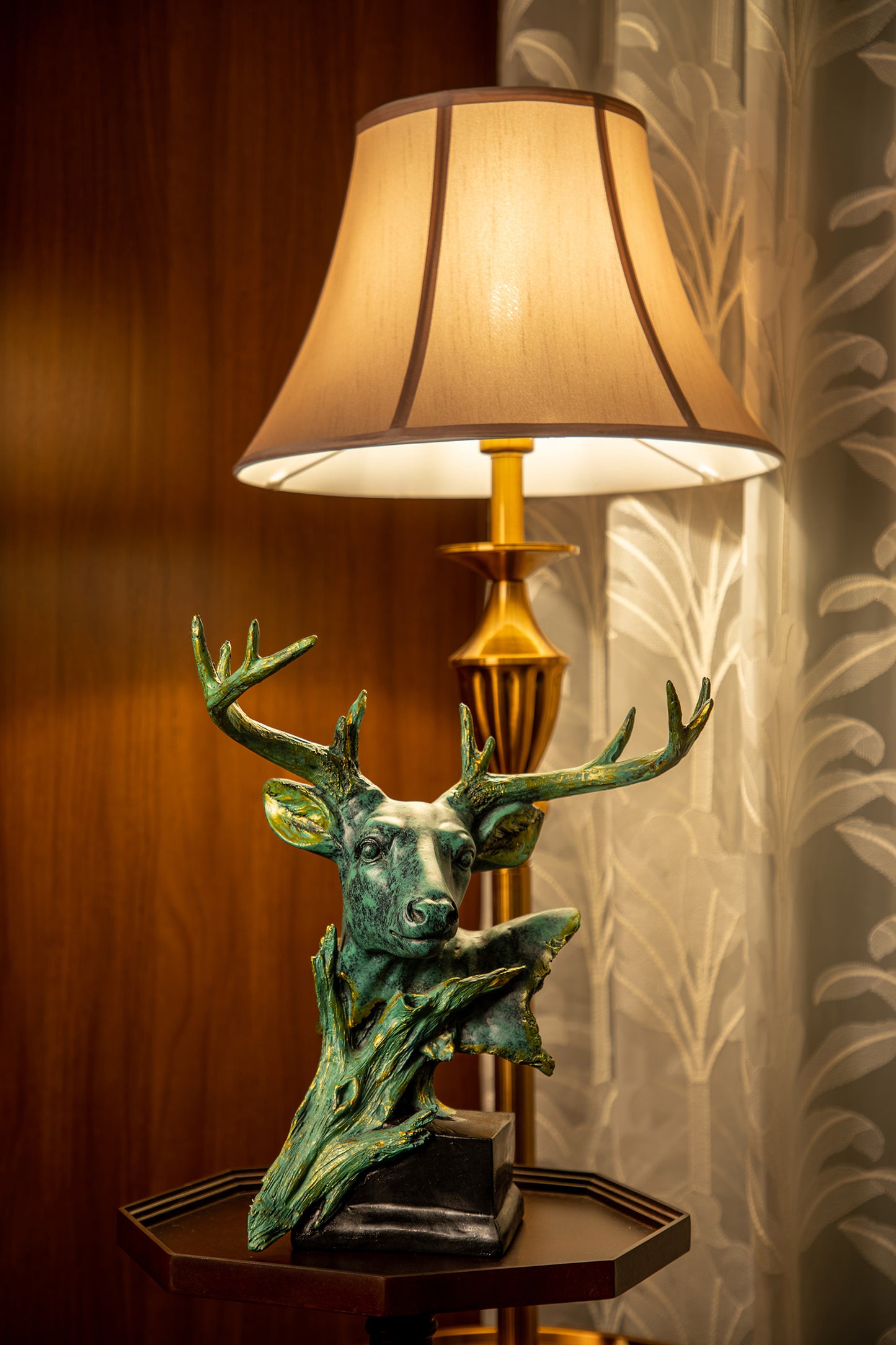 The sculpture is meticulously crafted, with intricate details that showcase the natural beauty of the deer.