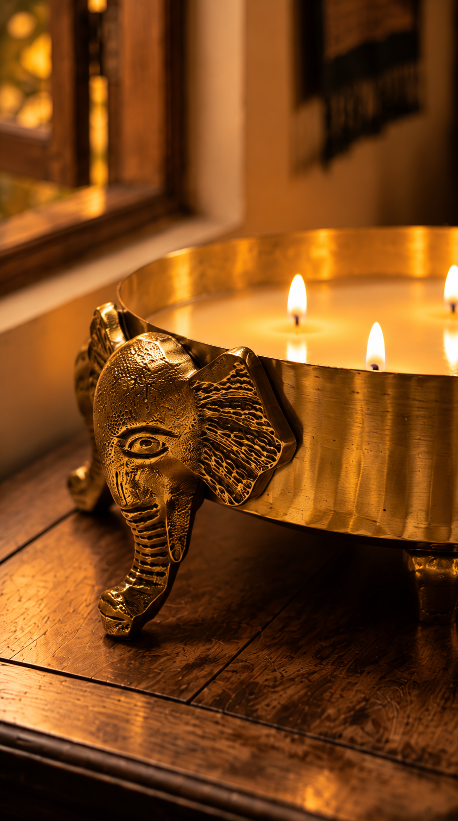 Gajraj Wax Urli - Filled with wax and lit with three wicks, it becomes a glowing centrepiece that turns any corner into a quiet sanctuary. Once the candle is spent, the urli lives on: fill it with water, float fresh flowers and tealights, or let it stand on its own as a sculptural accent on a console, coffee table, or pooja space.