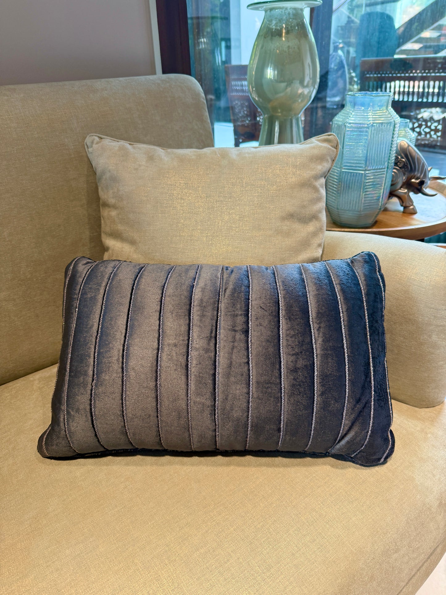 The Noir Velvet Cushion is crafted from ultra-soft velvet in a rich charcoal black, elevated with subtle vertical tufting that adds texture and polish.