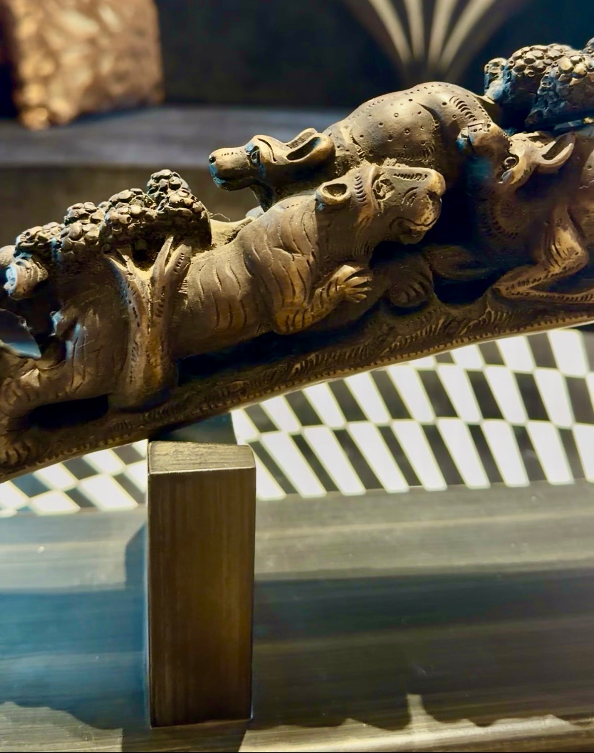 A Beautifully carved camel bone tusk, with carving inspirations from the abundance of history in the many many caves of india.
