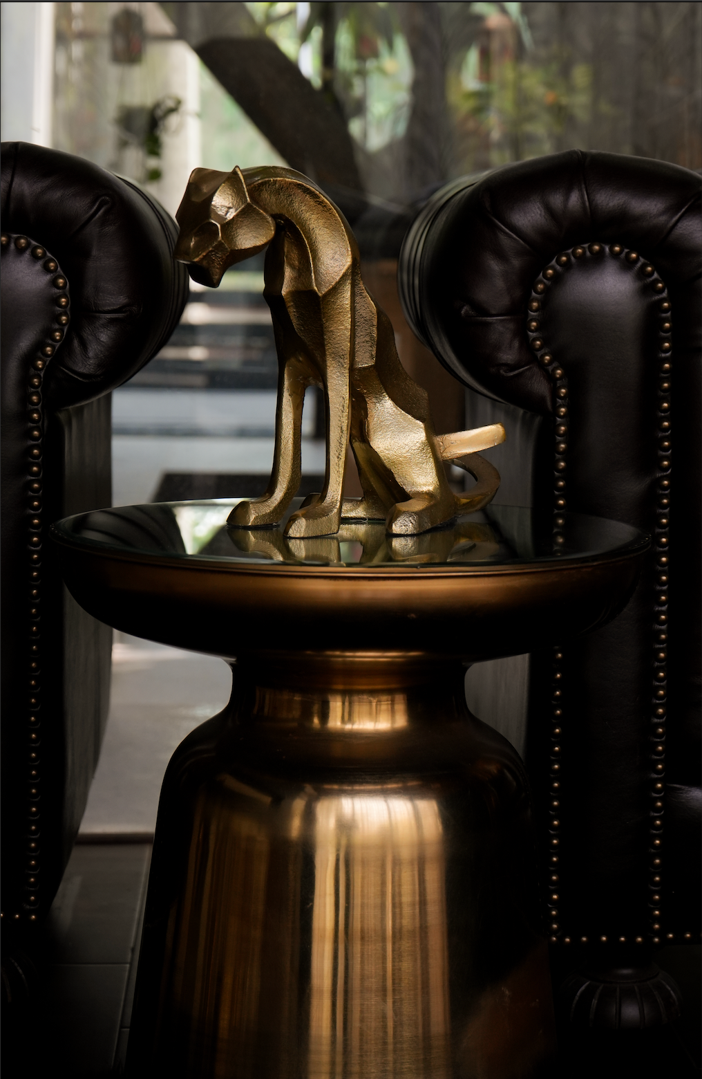 Our Majestic Nera Cheetah Sculpture, expertly crafted from sturdy metal and coated with a lustrous brass polish. This captivating piece captures the essence of the cheetah's grace and power, making it a stunning addition to any decor.