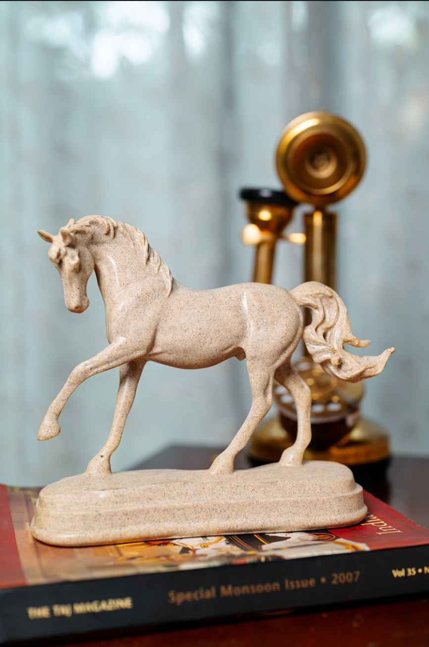 Bring a touch of elegance and timeless beauty to your decor with our Resin Horse on Stand. Capturing the majestic grace of a galloping horse, this meticulously crafted piece adds a sense of movement and vitality to any space.