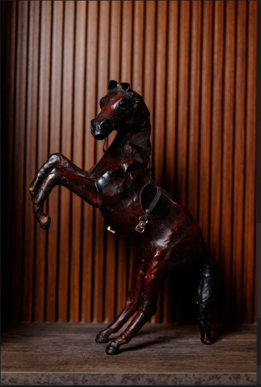 Bring the spirit of freedom and adventure into your home with our stunning Leather Galloping Horse. Crafted from high-quality leatherette, this exquisite piece captures the grace and power of a horse in mid-gallop, making it a perfect addition to any decor style.