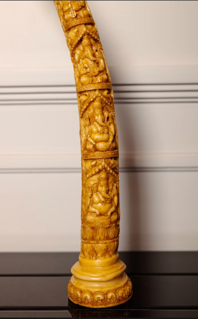 The beautifully detailed Ganesh idol exudes serenity and grace, symbolizing wisdom, prosperity, and the removal of obstacles. Complementing the idol, the camel bone tusks add a regal touch to your decor.