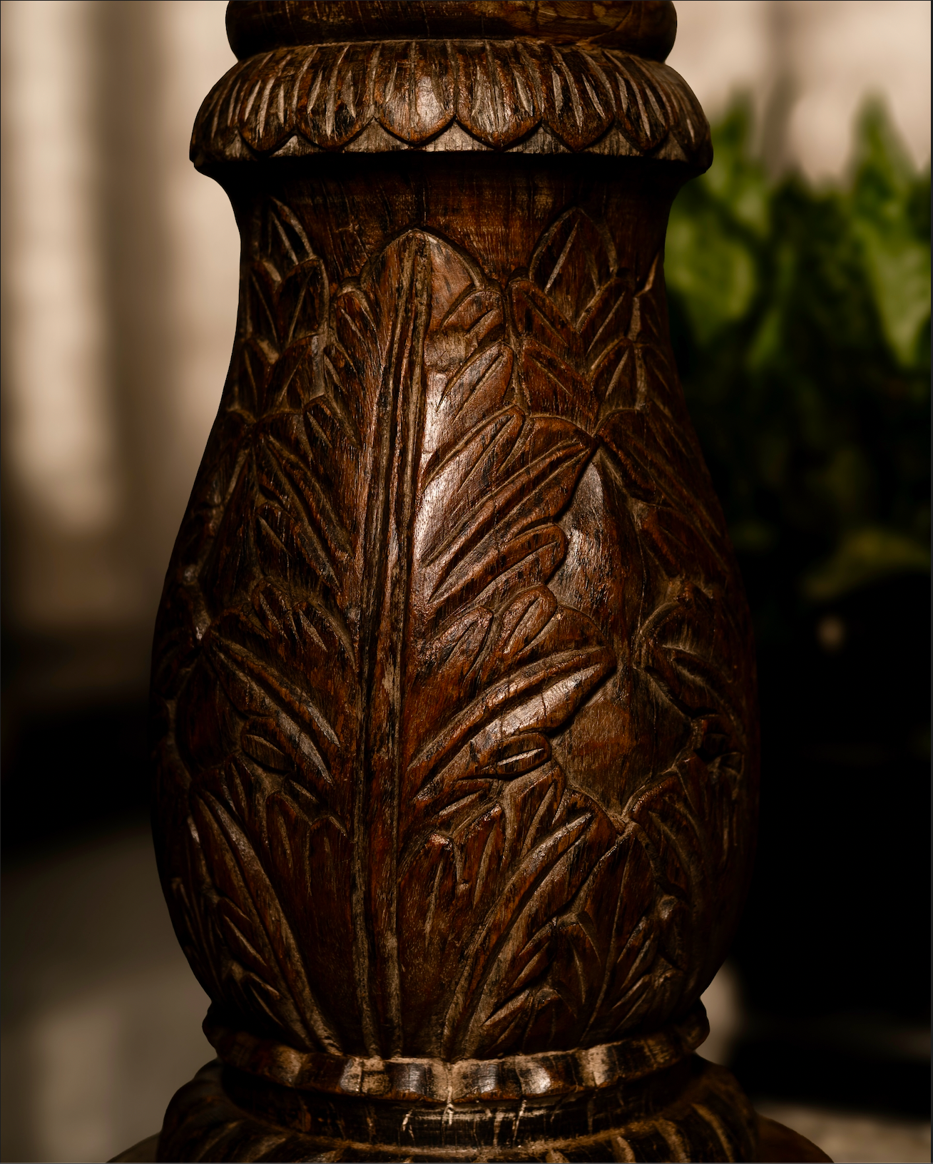 The Vanalata Stambh Candle Pillar is a celebration of nature carved into wood. Its rounded form is richly adorned with upward-flowing leaf motifs, evoking vines climbing toward light. Handcrafted from reclaimed solid wood.