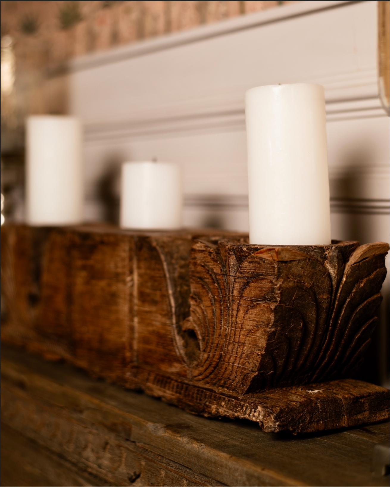 The Patra Stambh Candle Holder is a salvaged wooden fragment reimagined into a functional work of art. Its symmetrical form and flowing leaf motifs echo the language of traditional Indian carving.