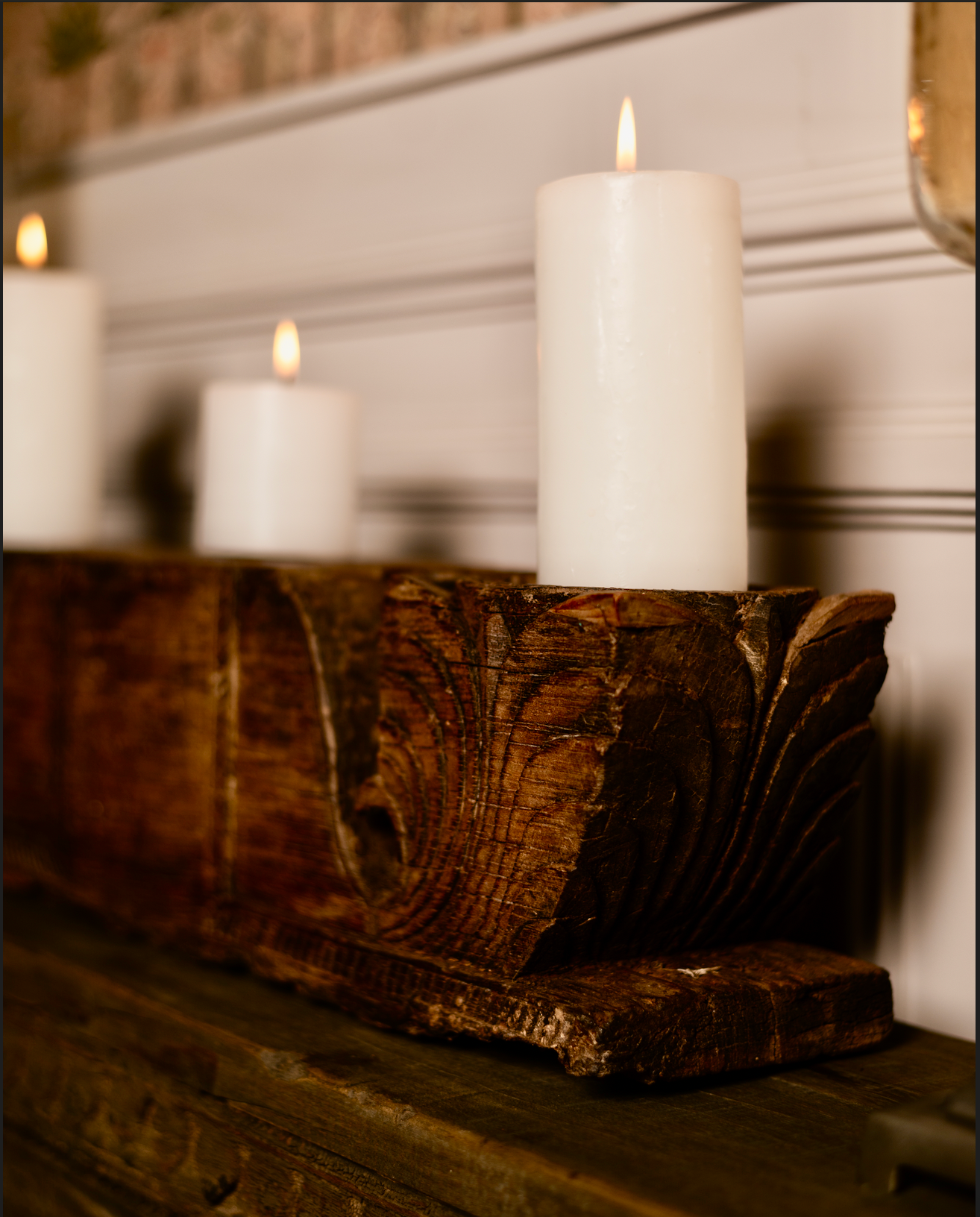 The Patra Stambh Candle Holder is a salvaged wooden fragment reimagined into a functional work of art. Its symmetrical form and flowing leaf motifs echo the language of traditional Indian carving.