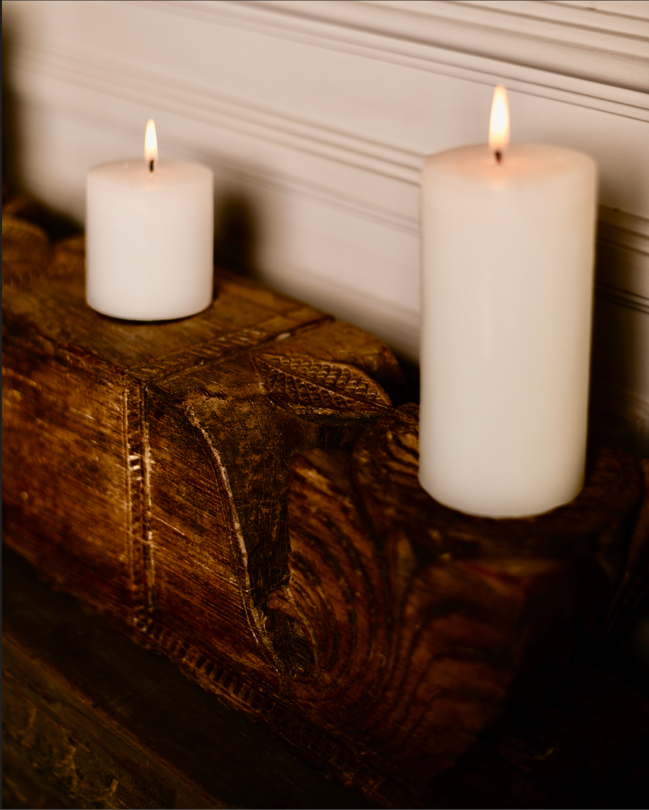 The Patra Stambh Candle Holder is a salvaged wooden fragment reimagined into a functional work of art. Its symmetrical form and flowing leaf motifs echo the language of traditional Indian carving.