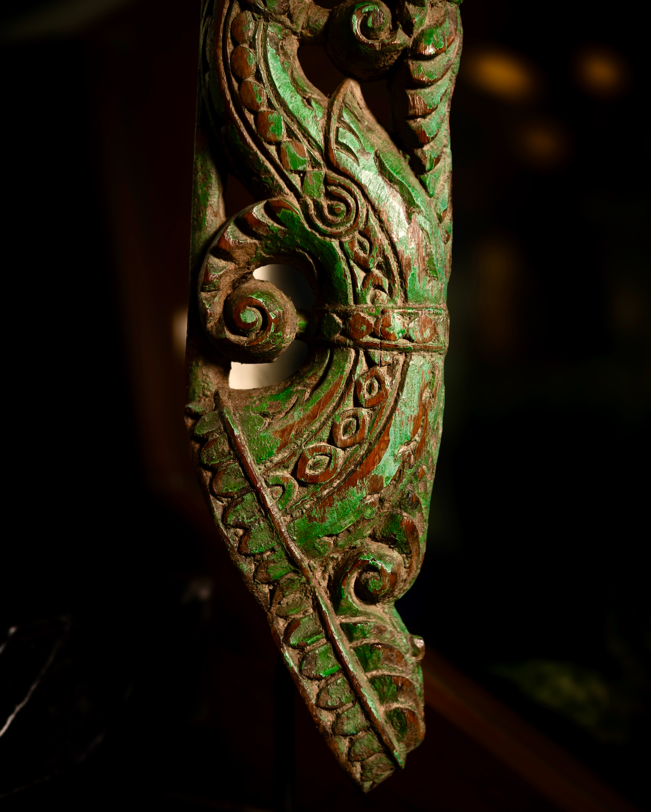 The Kritika brackets are salvaged fragments of heritage architecture, hand-carved from solid wood and finished with natural plant-based colors. Each piece is unique — Kritika I in deep green tones and Kritika II in earthy terracotta with teal accents