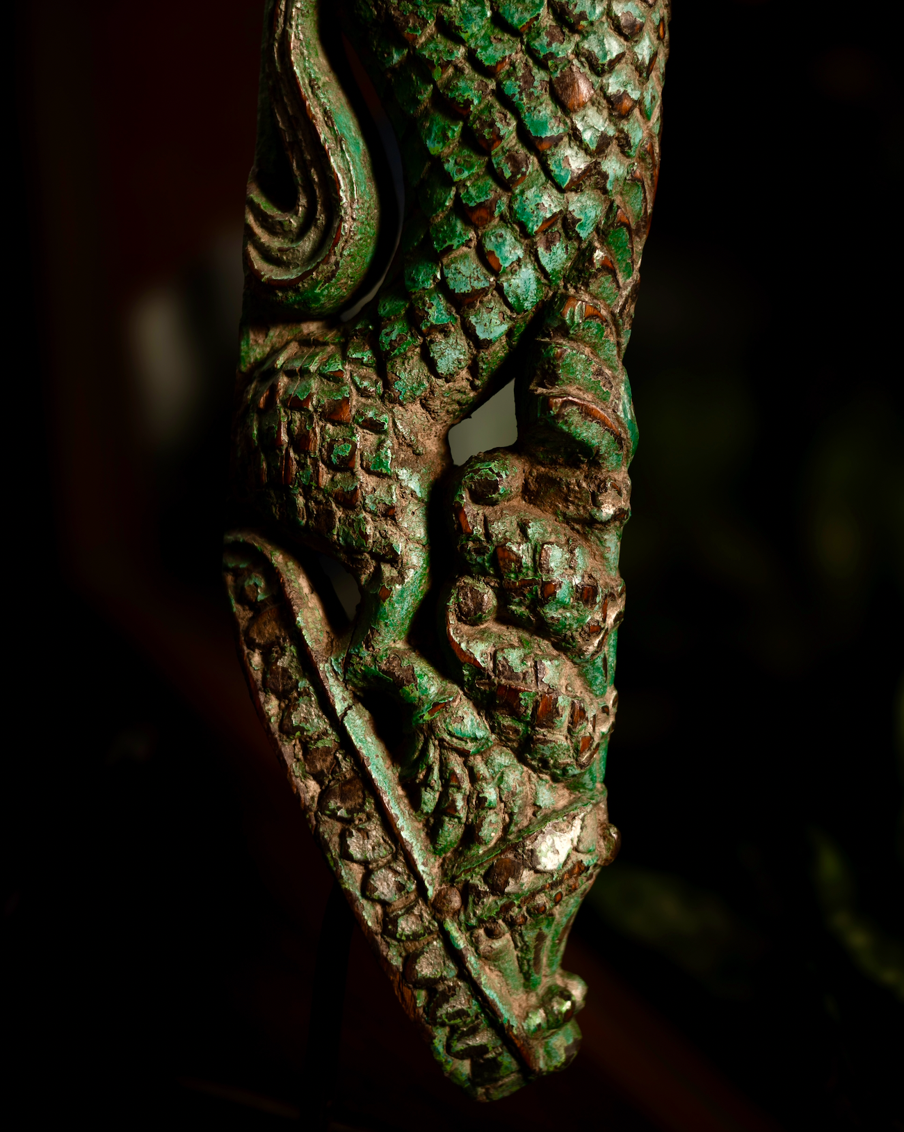 The Kritika brackets are salvaged fragments of heritage architecture, hand-carved from solid wood and finished with natural plant-based colors. Each piece is unique — Kritika I in deep green tones and Kritika II in earthy terracotta with teal accents