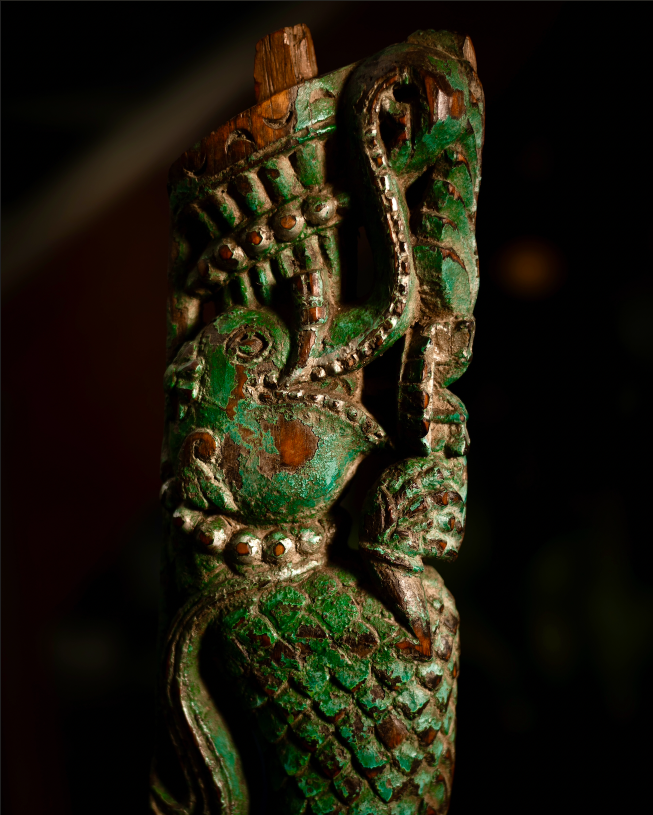 The Kritika brackets are salvaged fragments of heritage architecture, hand-carved from solid wood and finished with natural plant-based colors. Each piece is unique — Kritika I in deep green tones and Kritika II in earthy terracotta with teal accents