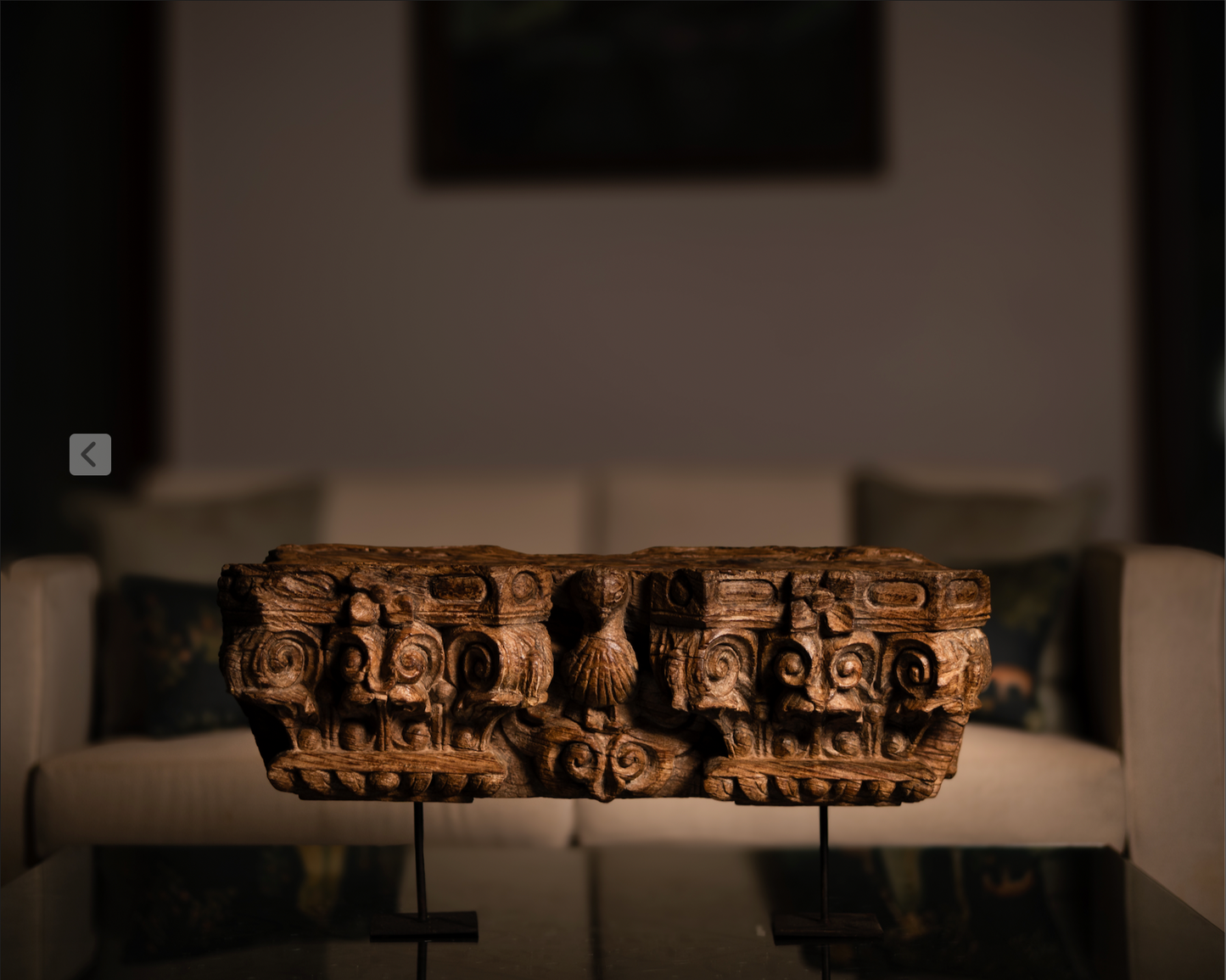 The Garuda Shilp is a remarkable salvaged fragment of heritage architecture, hand-carved from solid wood. With ornate scrollwork and a central bird motif reminiscent of Garuda, it reflects the grandeur and symbolism of temple and haveli design.