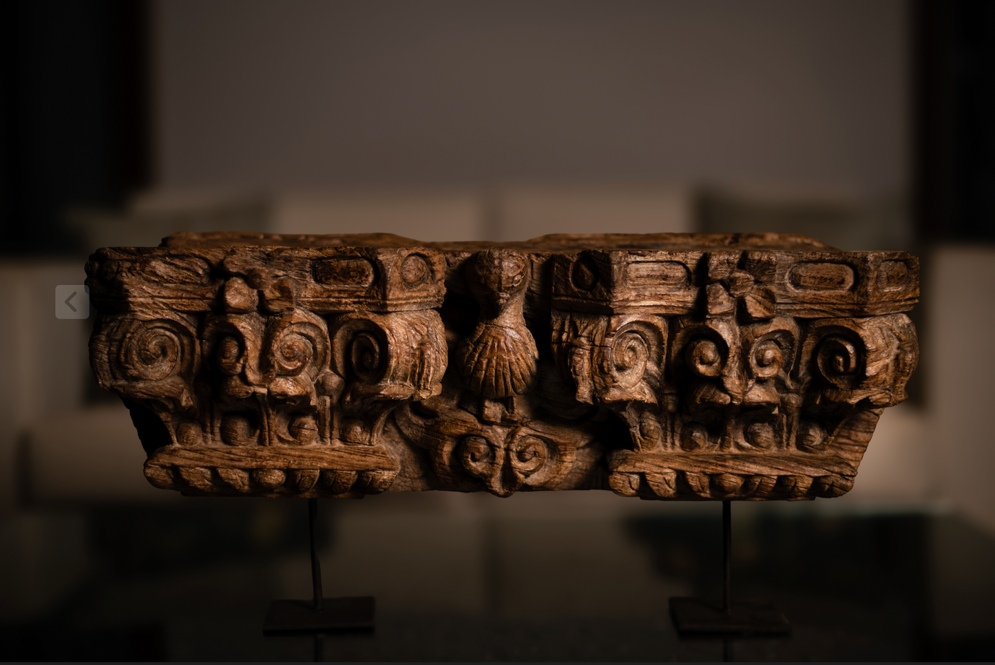 The Garuda Shilp is a remarkable salvaged fragment of heritage architecture, hand-carved from solid wood. With ornate scrollwork and a central bird motif reminiscent of Garuda, it reflects the grandeur and symbolism of temple and haveli design.