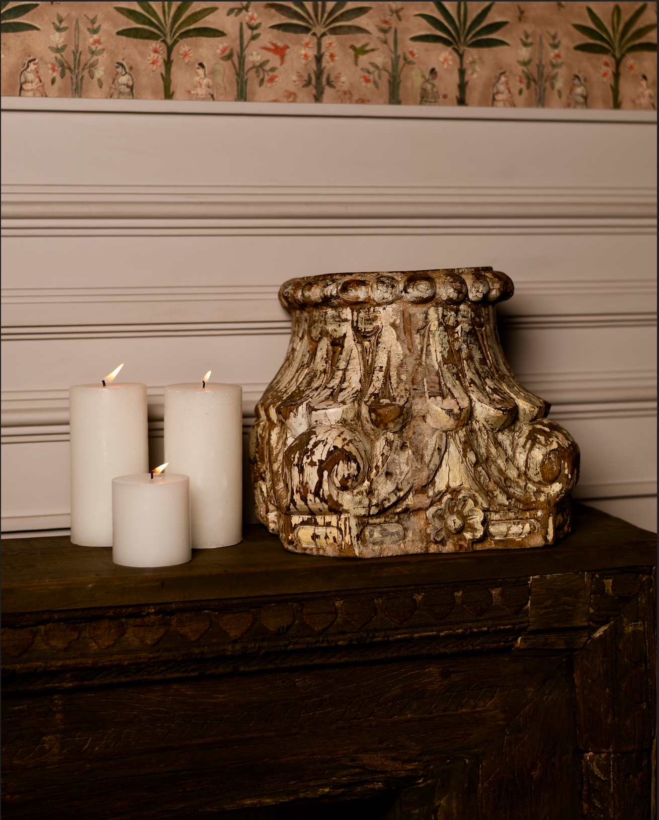 Hand-carved from reclaimed solid wood, the Ratna Stambh Candle Pedestal is a fragment of heritage reimagined for modern homes. Its intricate floral motifs, fluted carvings, and weathered patina evoke the richness of temple and haveli architecture