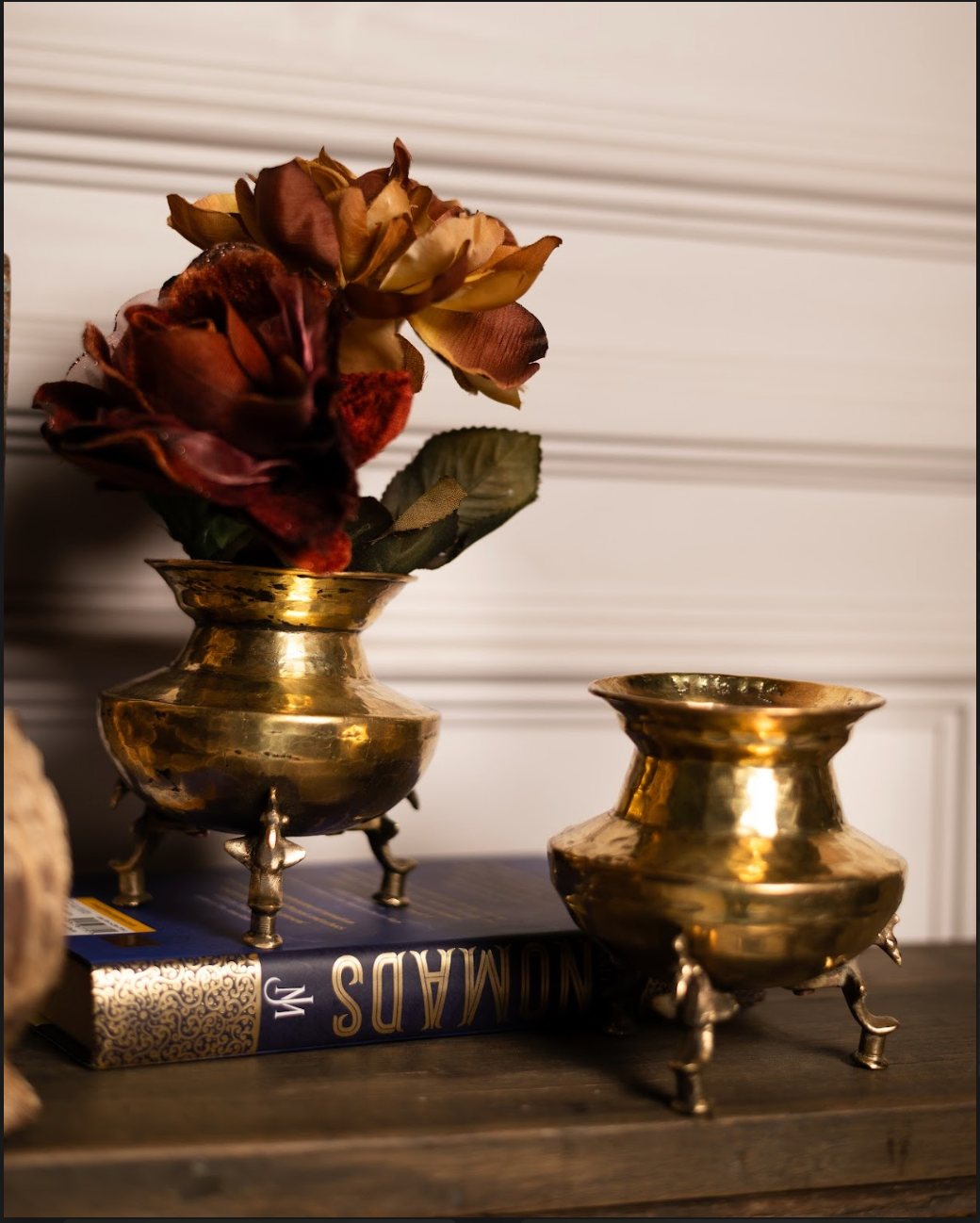 A charming miniature take on the classic Matka Vase, the Laghu Matka is handcrafted in pure brass with a warm golden sheen. Resting on delicately sculpted legs, it brings a playful elegance to the timeless matka form