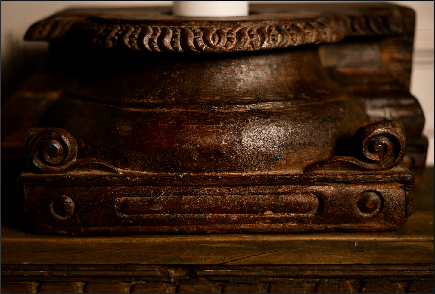 An antique wooden pedestal reimagined as a candle holder, Jyotirmay carries the glow of heritage and the warmth of tradition. Its hand-carved details and deep, rich patina make it a timeless accent for your living space.