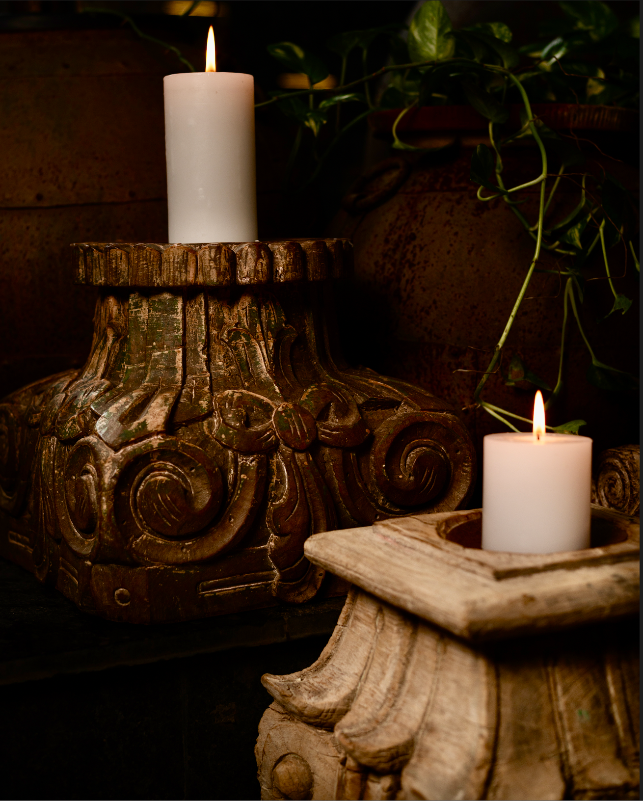 The Harita Stambh Candle Pedestal echoes the grandeur of old-world architecture, carved by hand from solid wood and finished with natural, plant-based green hues.