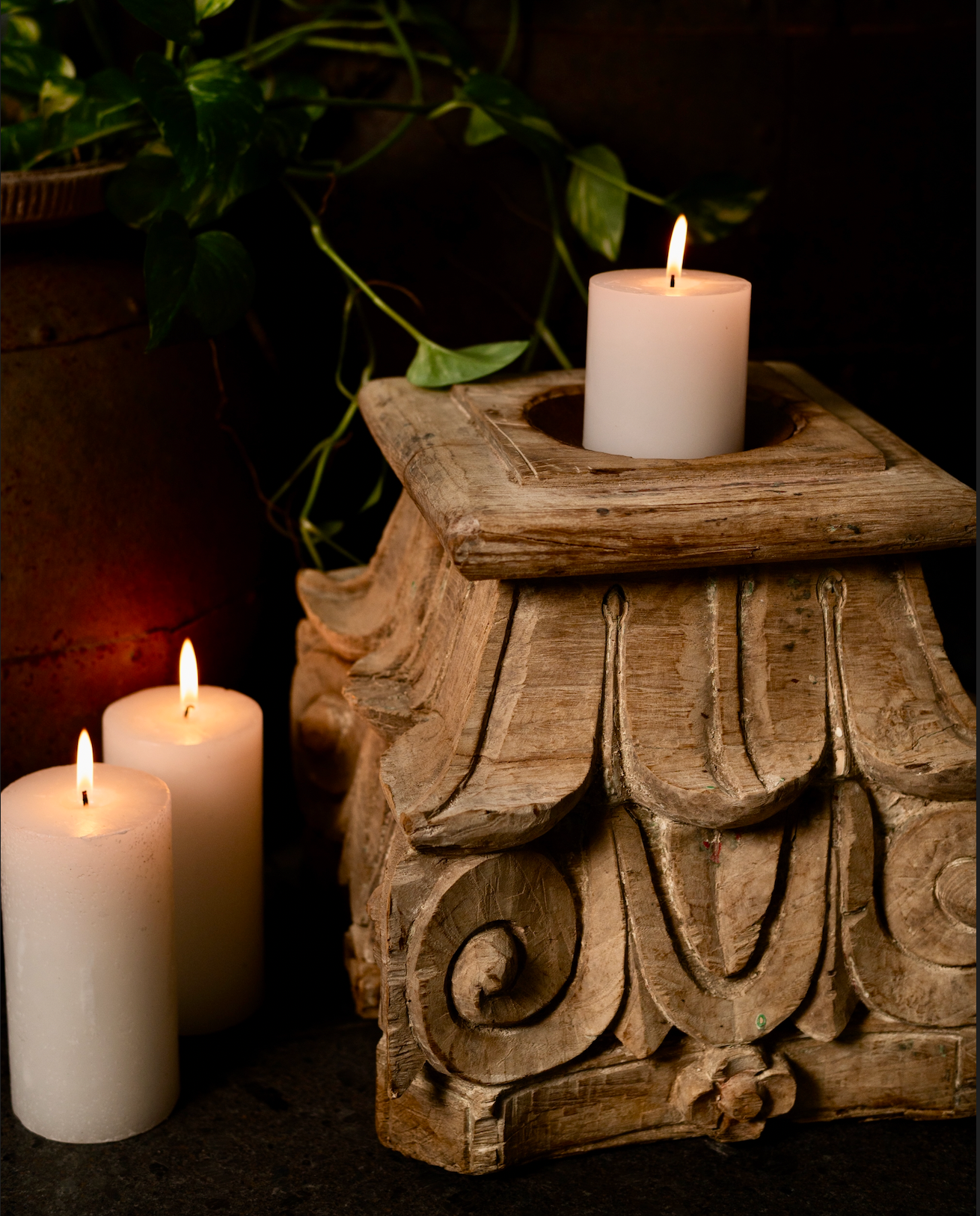The Stambh Jyoti Candle Pedestal draws its inspiration from classical Indian architecture — carved from solid wood and finished in natural, earthy tones