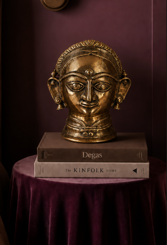 A serene sculptural bust of Goddess Gauri, cast in pure brass and finished by hand.