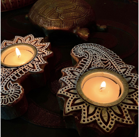 Imprint block Tea Light holders are Made of 100% sheesham Wood & are Available as a set of 2. these come in floral & elephant patterns.