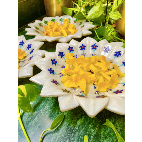 White & Yellow Marble Urli's With Colourful Nature Inspired Hand Painted Details Within.