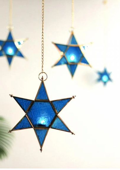 These colourful starlight tea light holders are made of lacquered brass and glass. Come in yellow, pink & blue.