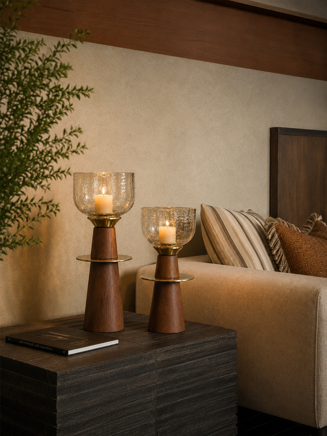 A pair of tapered wooden candle stands crowned with hand-textured glass bowls that catch and scatter candlelight beautifully. 