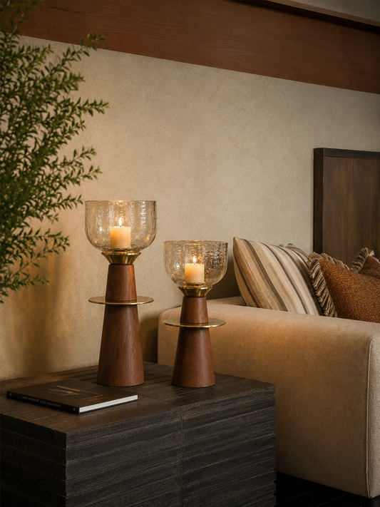 A pair of tapered wooden candle stands crowned with hand-textured glass bowls that catch and scatter candlelight beautifully. 