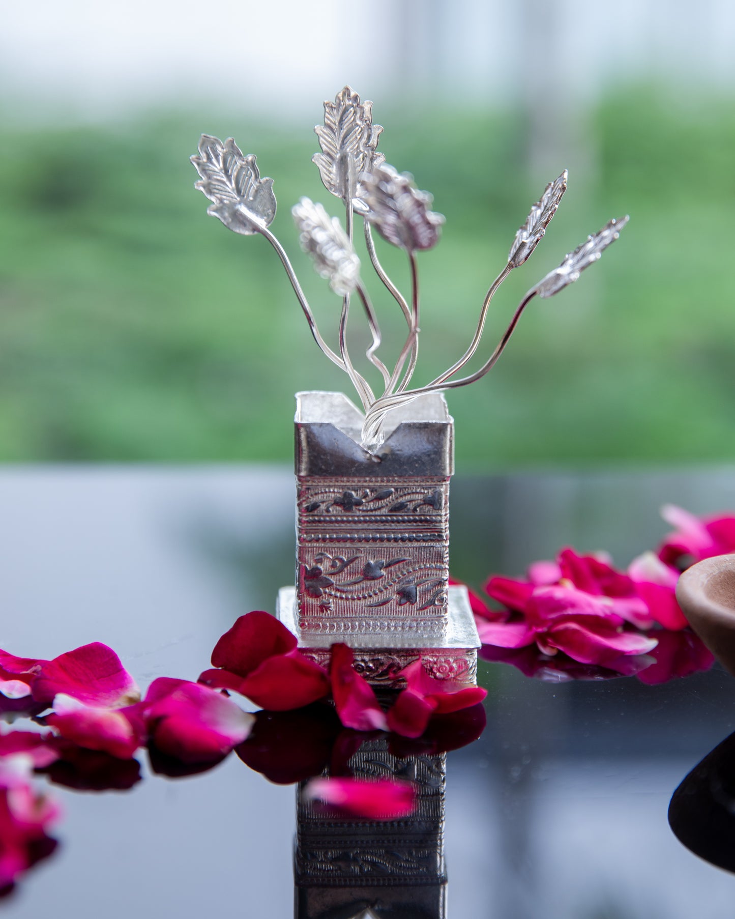 Our Silver Plated Tulsi Plant, meticulously crafted to capture the essence of the Tulsi plant, with intricate leaves and branches that reflect the richness of tradition.