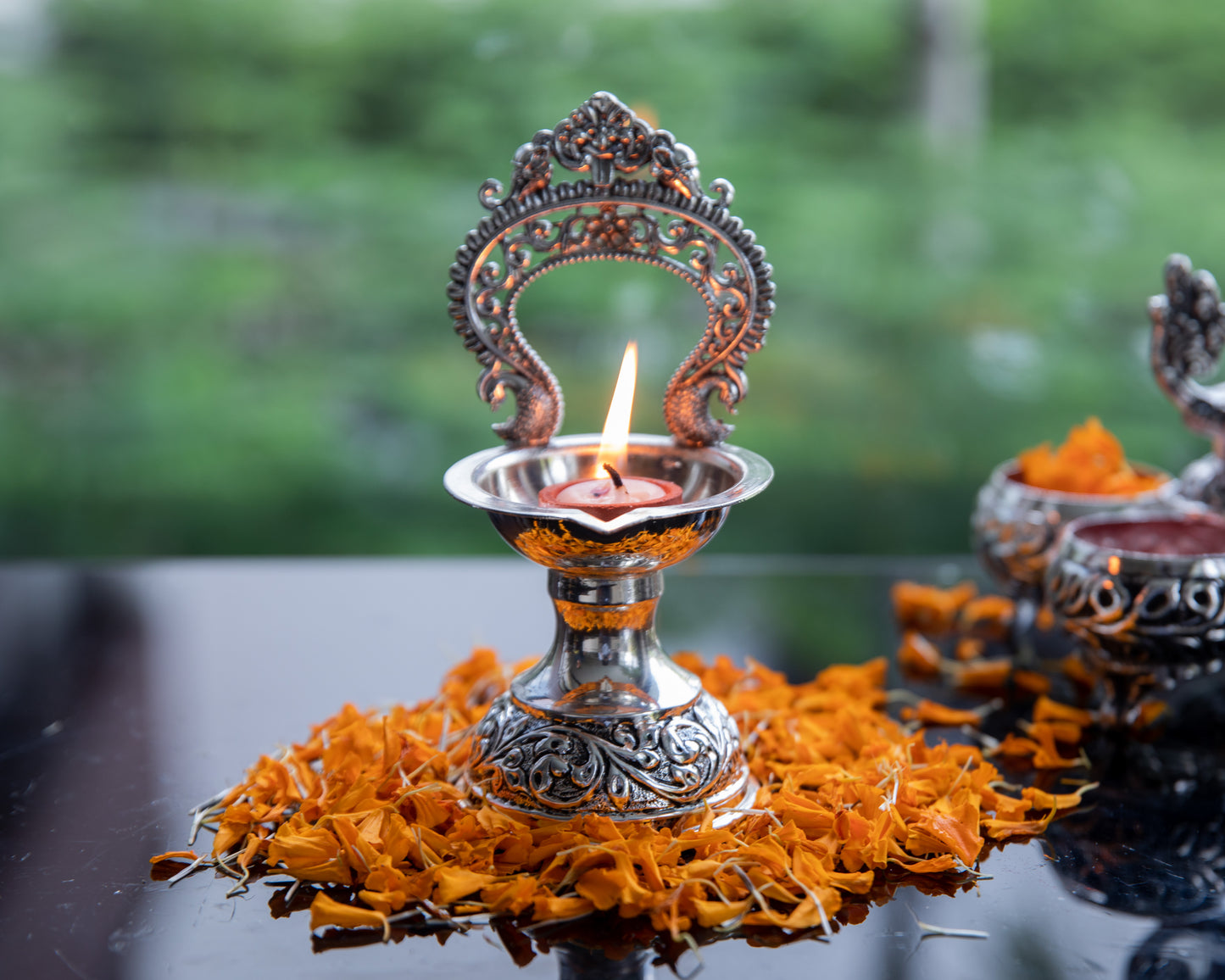 Prabhavali Diya is coated with high-quality silver, this diya radiates a lustrous and timeless glow when lit.