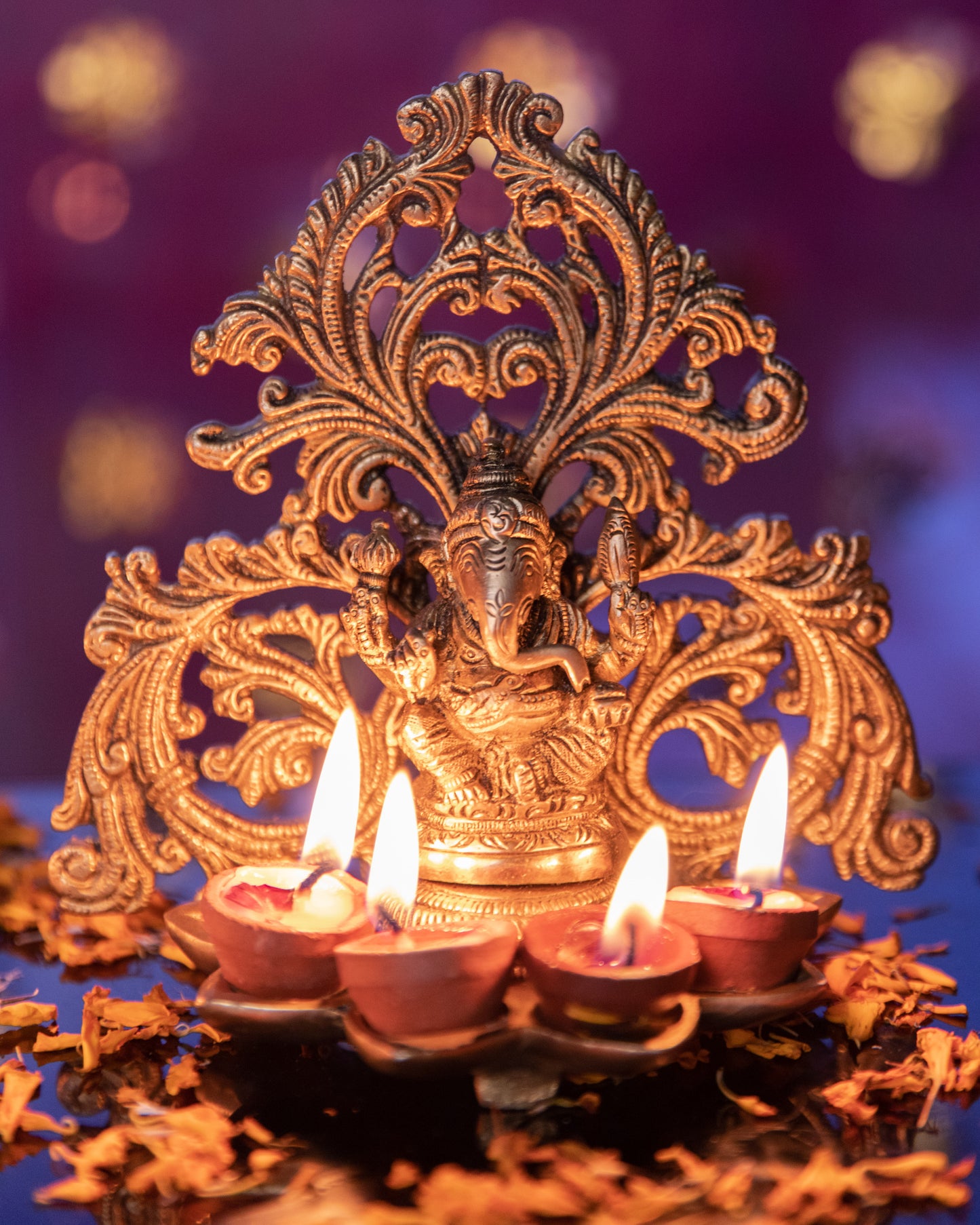 LeelaTheStore's Brass Laxmi and Lord Ganesha Diya, the intricate design diya stand radiates a warm and soothing glow when lit.