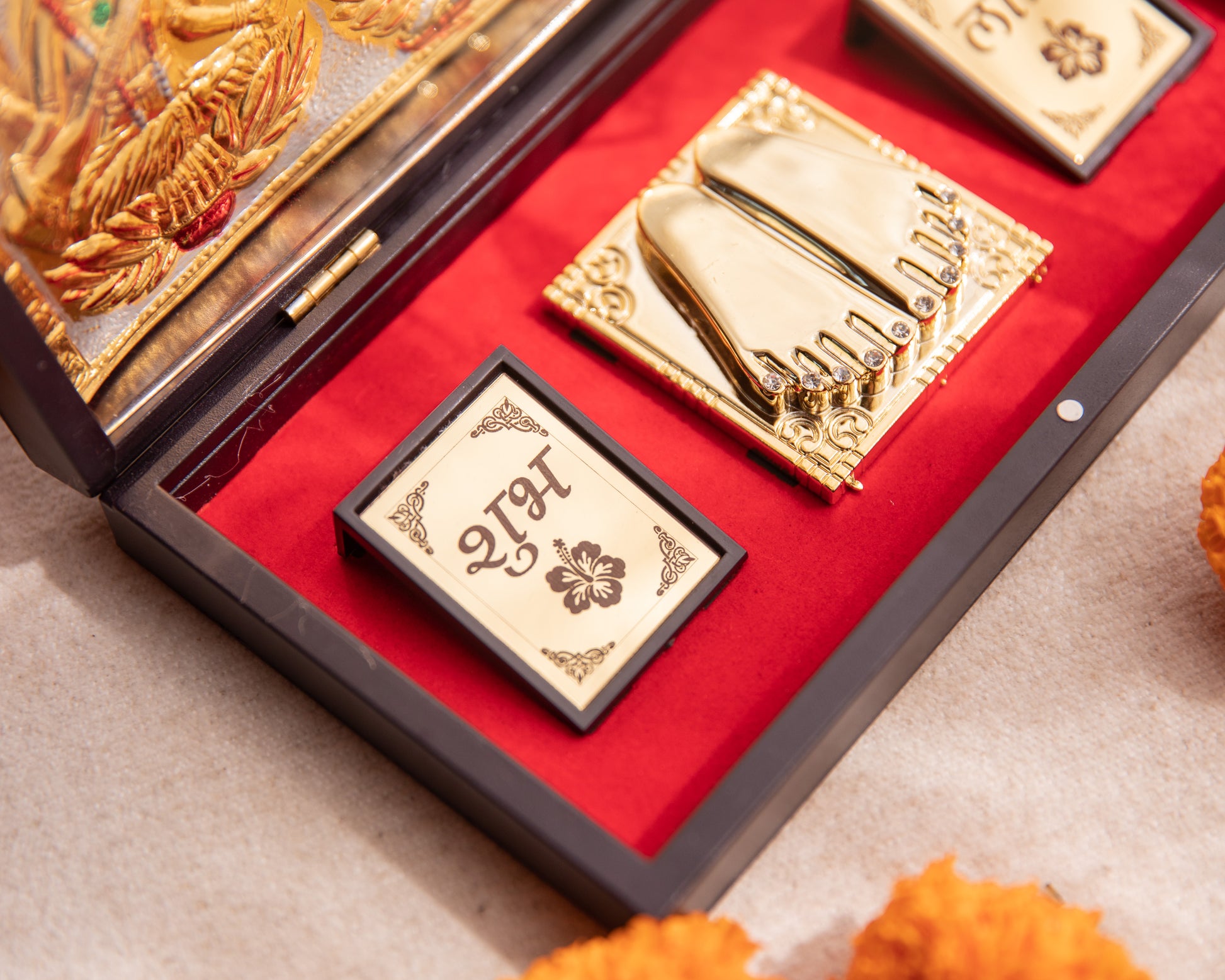 LeelaTheStore’s divine 24K Laxmi, Ganesh, and Saraswati Pooja Box, the 3 idols have been engraved onto the top half of the box and have been finely wrapped in gold foil.