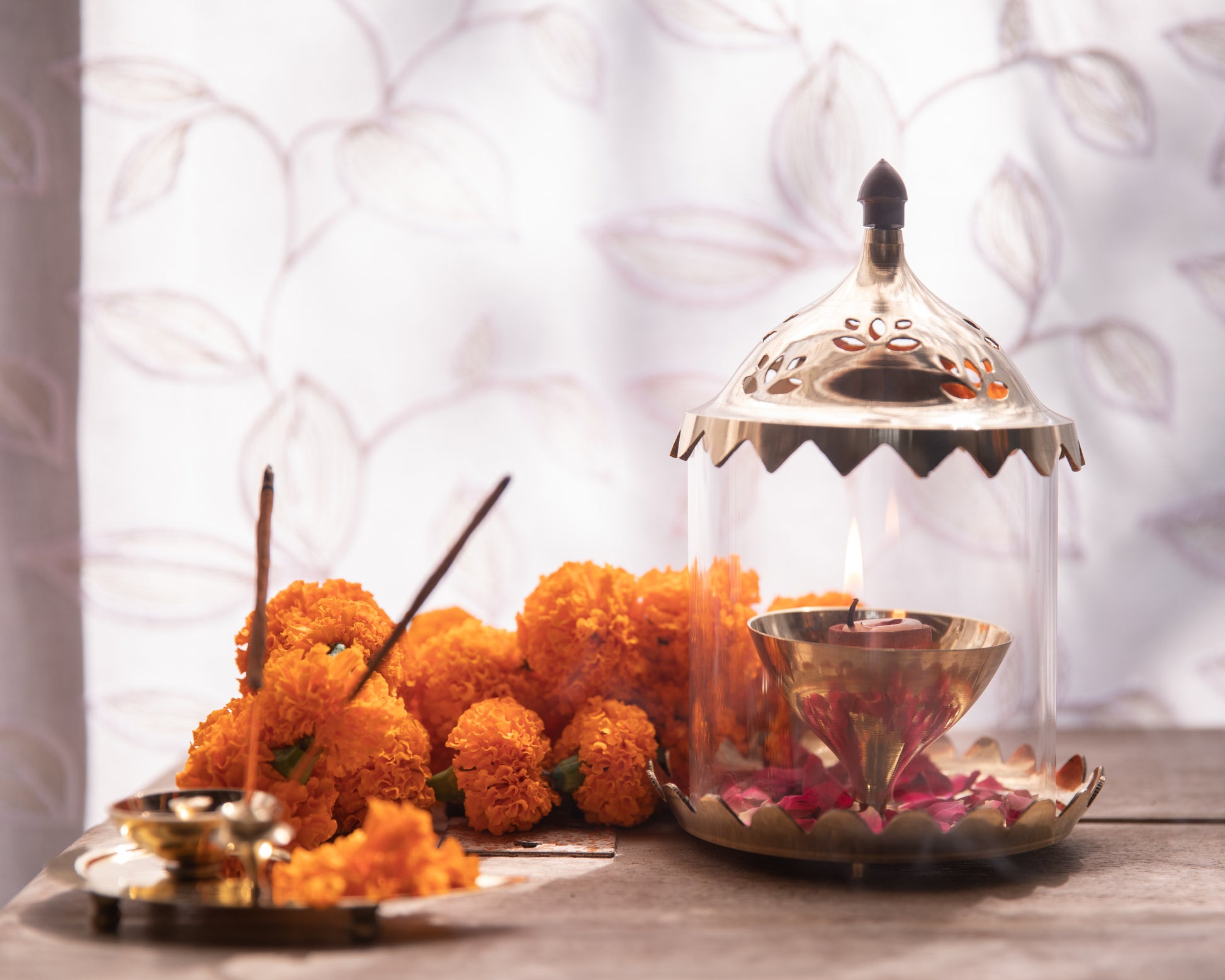 Our Glass Akhand Diya boasts a sleek and elegant design crafted from high-quality, transparent glass.