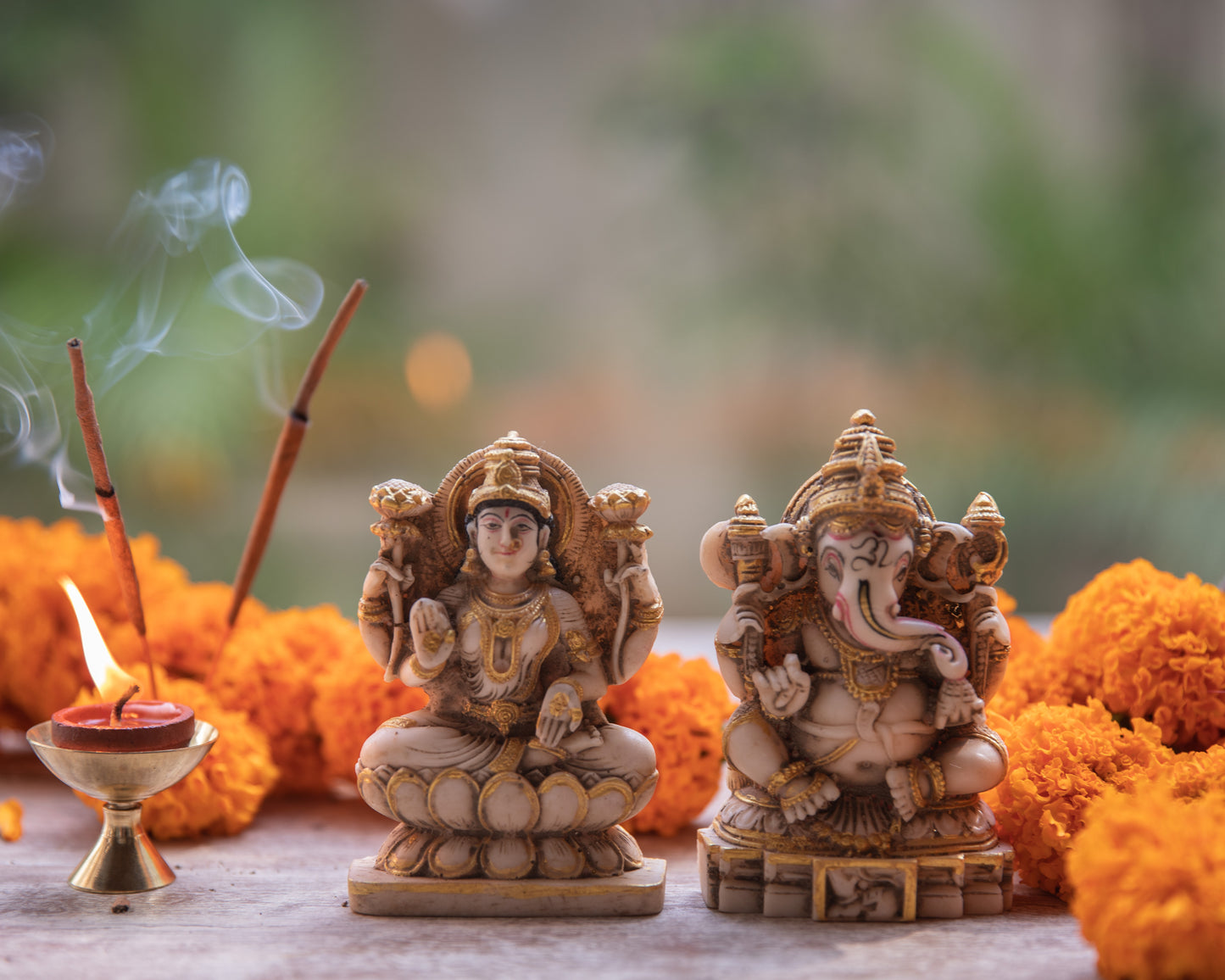A divine and harmonious representation of two beloved deities, Goddess Lakshmi, the symbol of wealth and prosperity, and Lord Ganesh, the remover of obstacles.