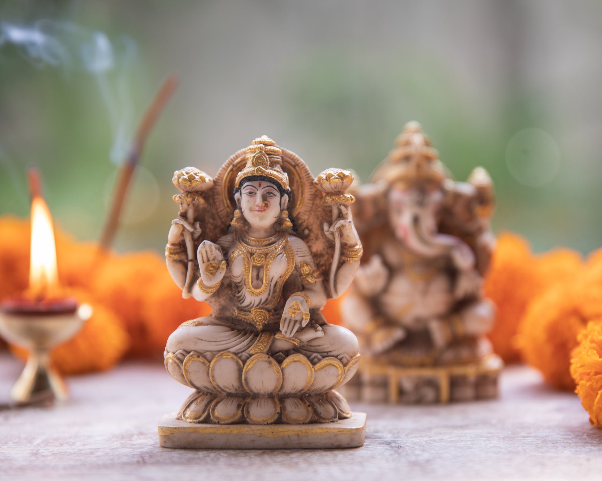 A divine and harmonious representation of two beloved deities, Goddess Lakshmi, the symbol of wealth and prosperity, and Lord Ganesh, the remover of obstacles.