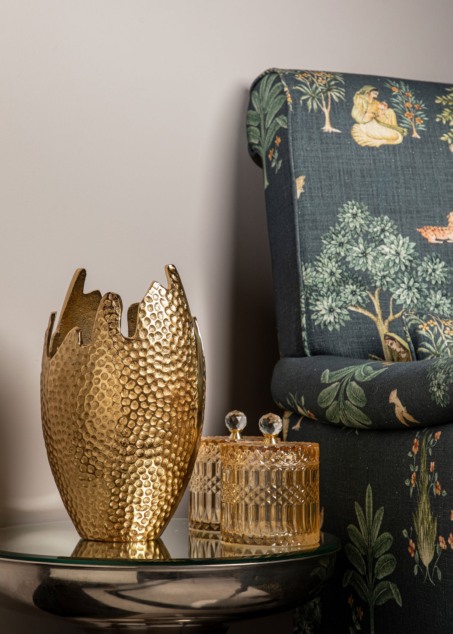 The Brass Dotted Vase boasts a modern design with tiny brass dots that add a unique and captivating texture.