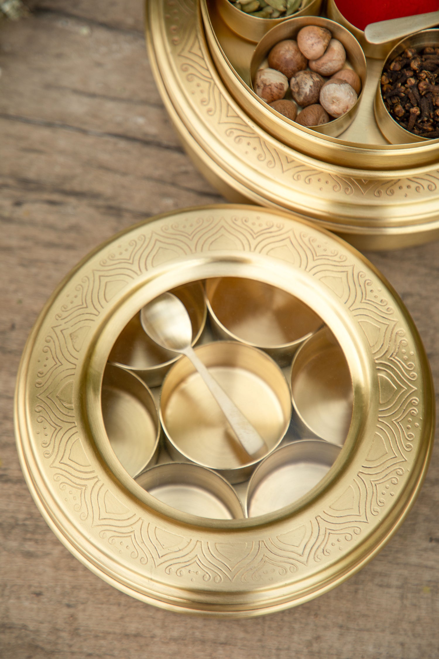 Crafted from brass, these masala box offers a lustrous finish that adds a touch of sophistication and opulence to your kitchen.