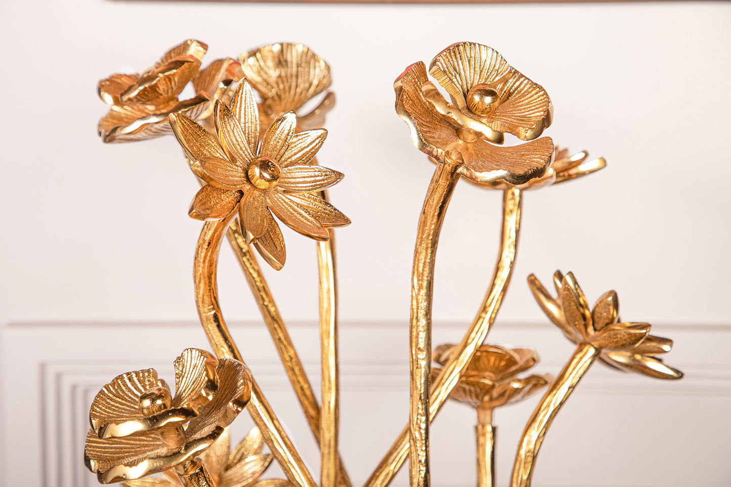 Crafted from pure brass and inspired by the intricate details of blossoming flowers.