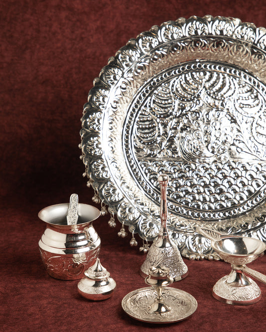 Plated from silver, this thali is a glistening masterpiece that exudes sophistication and charm.