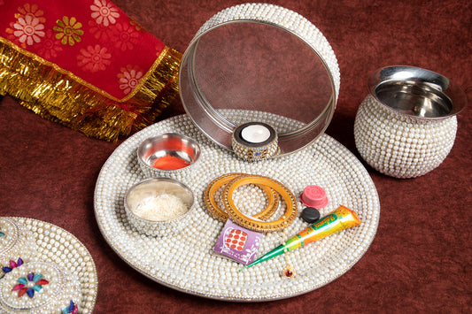 Our Karwa Chauth Pearl Thali is a stunning masterpiece, crafted to enhance the significance and beauty of this cherished ritual.
