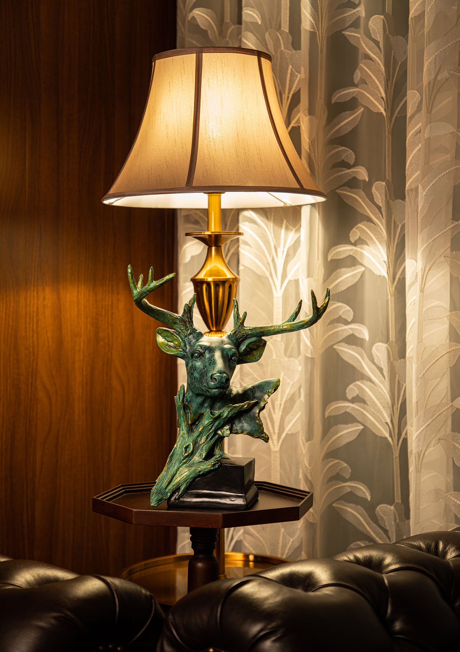 The sculpture is meticulously crafted, with intricate details that showcase the natural beauty of the deer.
