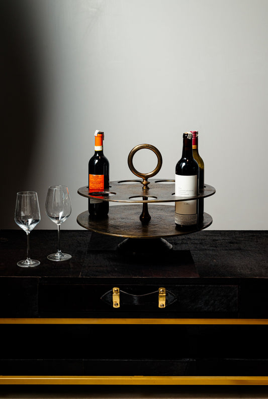 Display your wine collection in style with our Vino Orbit Holder ,designed to hold up to 7 bottles. Crafted from durable metal with a sleek and modern aesthetic, this wine holder is both a functional storage solution and an eye-catching piece of decor. 